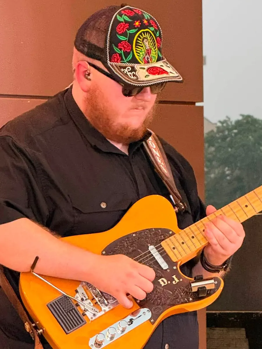 David Jones playing his Telecaster on stage