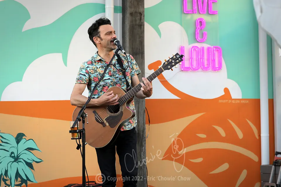 Milano performing live with his guitar at Republica