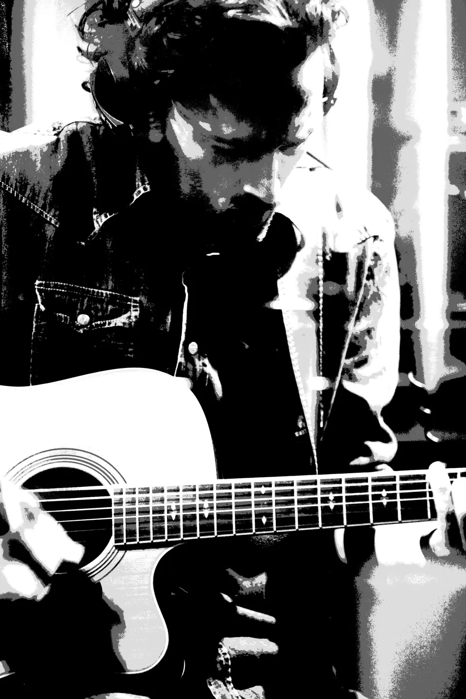 Black and white portrait of Milano with his guitar